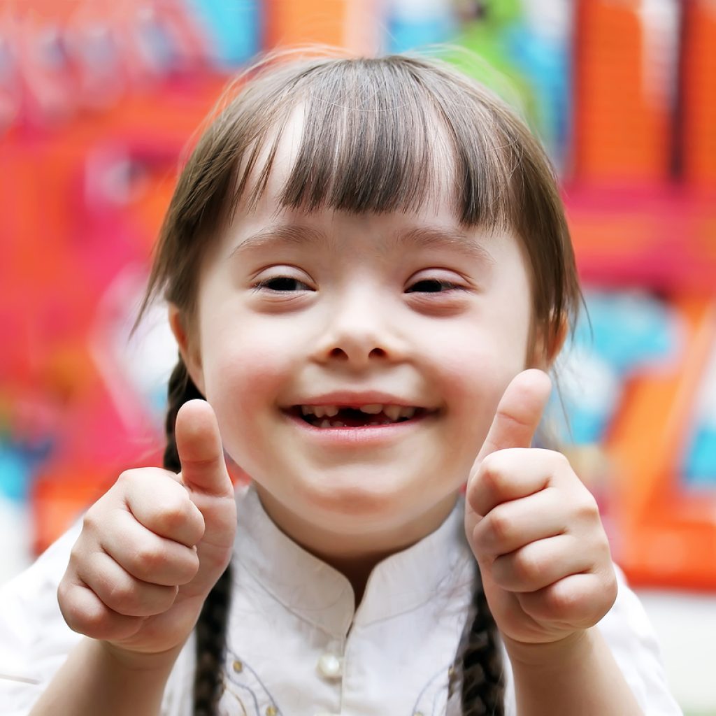 Portrait Of Beautiful Happy Girl Giving Thumbs Up.